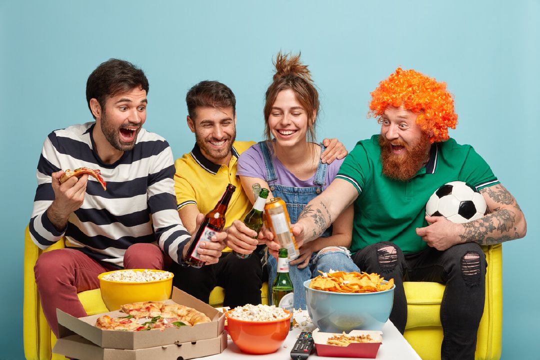 images/four-cheerful-friends-clink-bottles-beer-have-spare-time-together-watch-football-match-broadcast-sport-event-tv-home-have-popcorn-pizza-chips-table-cheer-favorite-team.jpg